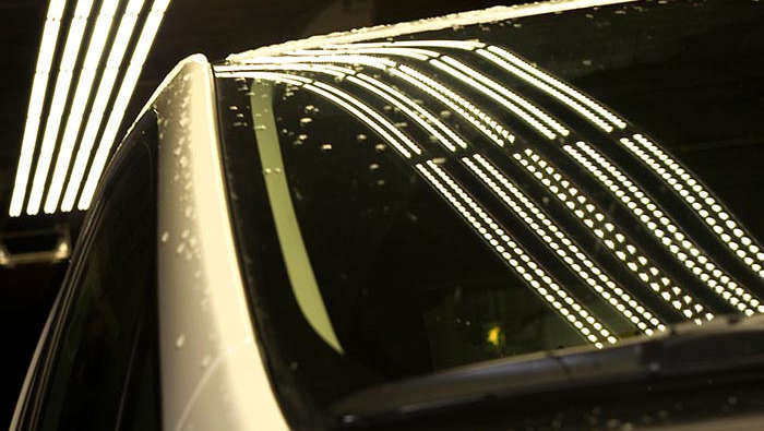 Tunnel’s light reflection in a car 