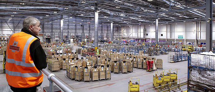 A warehouse hall lit up by Philips industrial lighting